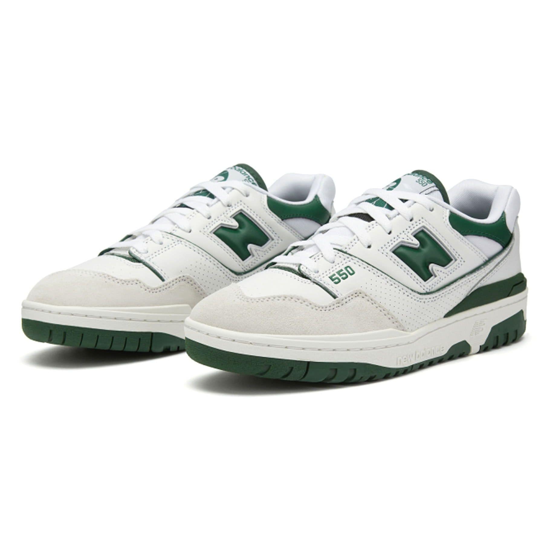 New Balance 550 sneakers in white with green detail